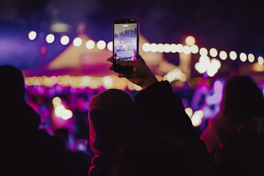 woman checking phone at event